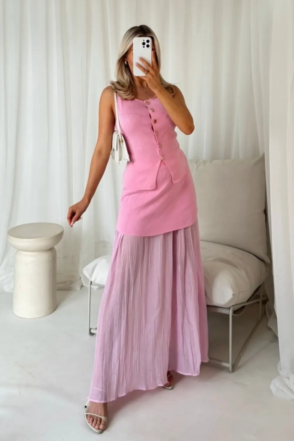 Delilah pink knit waistcoat & pleated sheer maxi skirt