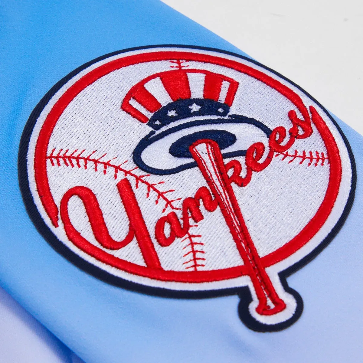 MLB NEW YORK YANKEES LOGO MEN'S TRACK JACKET (BLUE/WHITE/PINK)